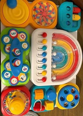 Tableau d’activités sensorielles pour enfant avec attaches et jeux de manipulation
